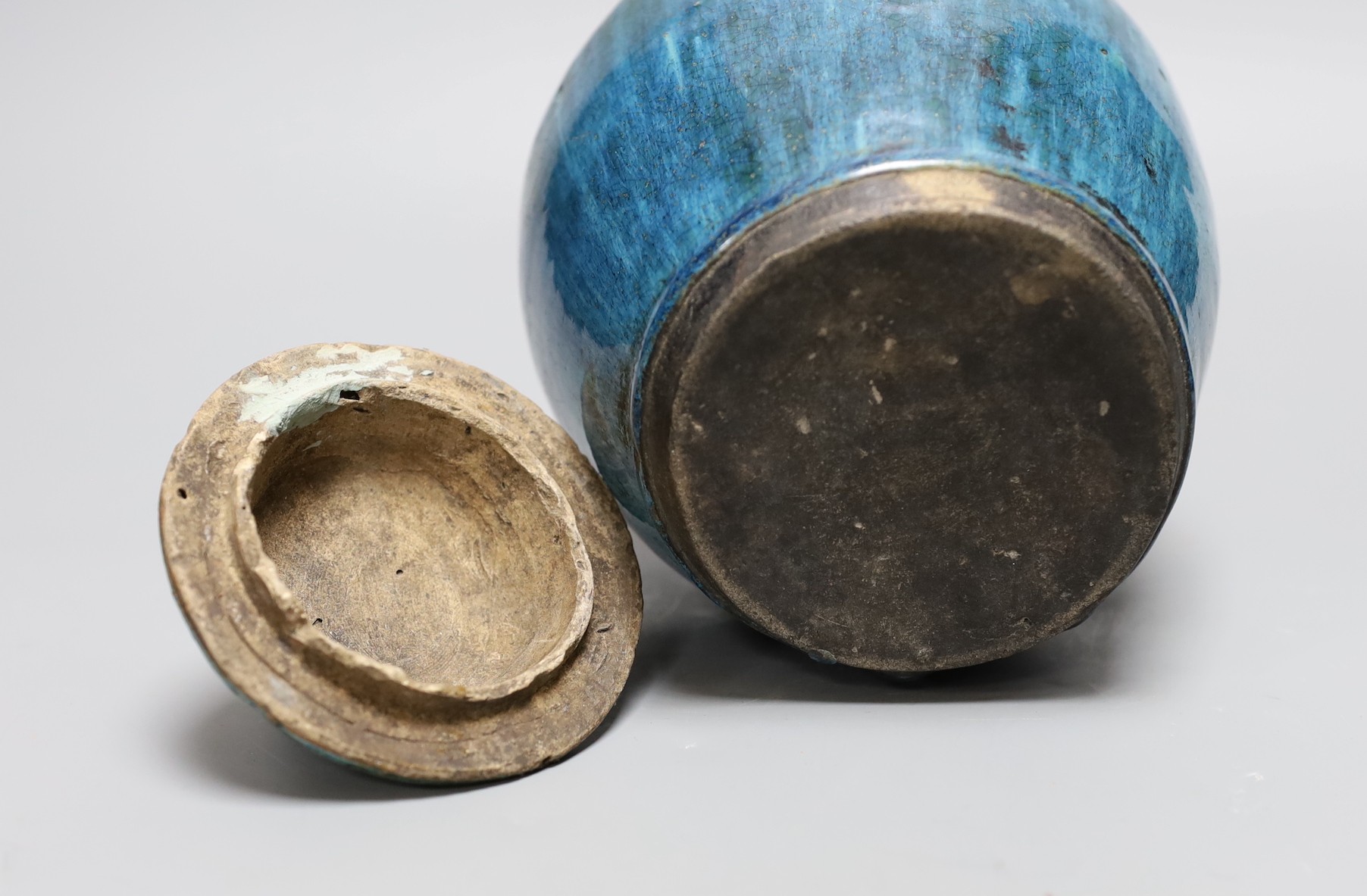 A Chinese mottle glazed terracotta jar and cover, 19th century, 24 cms high